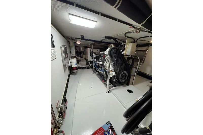 Slide: The Image of Engine room of 2008 Kadey-Krogen 44 Walk Around yacht, showcasing machinery and equipment. - 47