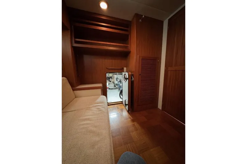 Slide: The Image of 2008 Kadey-Krogen 44 Walk Around interior with wood paneling and cozy seating area. - 46