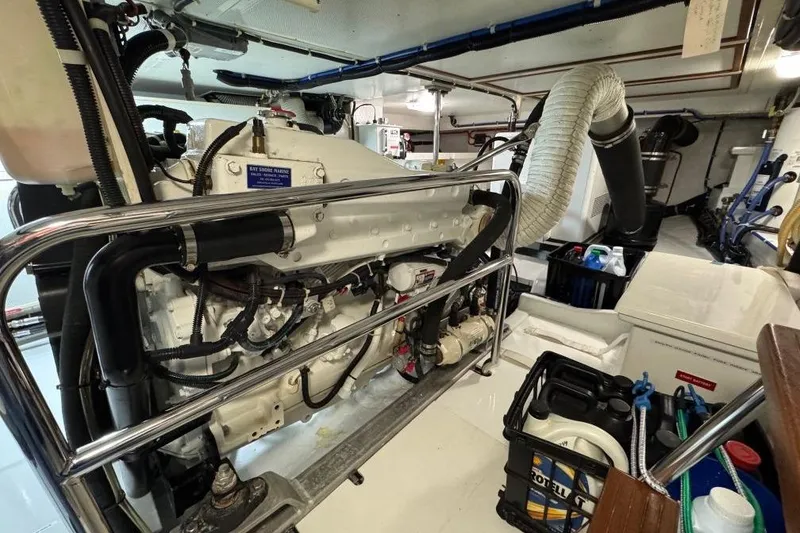 Slide: The Image of Engine room of 2008 Kadey-Krogen 44 Walk Around, showcasing mechanical components and storage. - 50