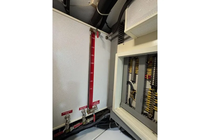 Slide: The Image of Engine room of 2008 Kadey-Krogen 44 Walk Around with control panel and gauges. - 56