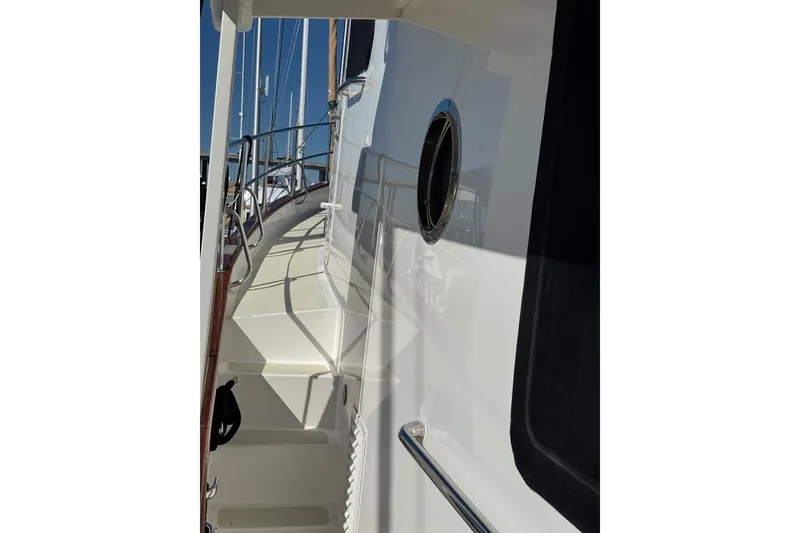 Slide: The Image of Kadey-Krogen 44 Walk Around 2008 yacht deck with railing and porthole. - 77