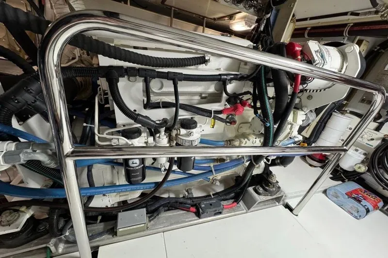 Slide: The Image of Engine room of 2008 Kadey-Krogen 44 Walk Around yacht, featuring complex machinery and wiring. - 51