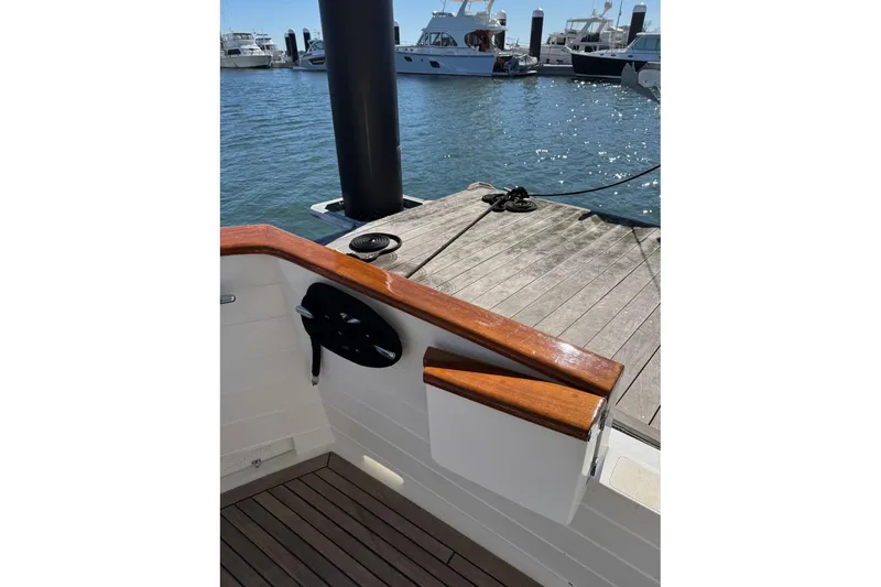 Slide: The Image of 2008 Kadey-Krogen 44 Walk Around yacht docked at marina with wooden deck. - 3