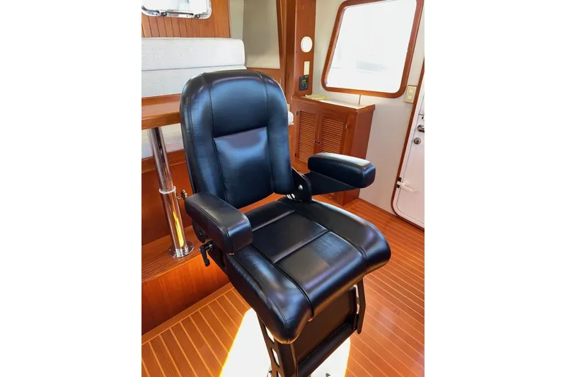 Slide: The Image of Luxurious black captain's chair on 2008 Kadey-Krogen 44 Walk Around yacht. - 67