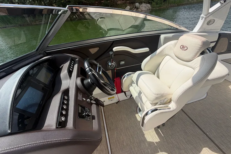Slide: The Image of 2019 Cobalt R5 boat interior with steering wheel and luxurious captain's chair. - 27
