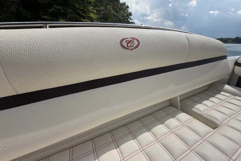 Slide: The Image of 2019 Cobalt R5 boat interior with white leather seating and embroidered logo. - 18