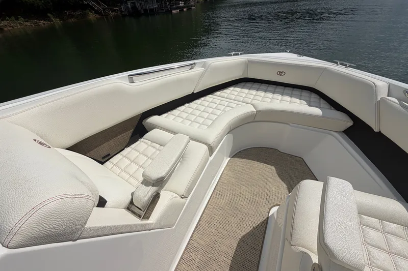 Slide: The Image of Luxurious seating on a 2019 Cobalt R5 boat, featuring elegant white upholstery. - 25
