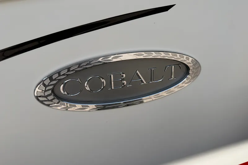 Slide: The Image of Cobalt R5 2019 emblem on a sleek white surface, showcasing luxury design. - 30