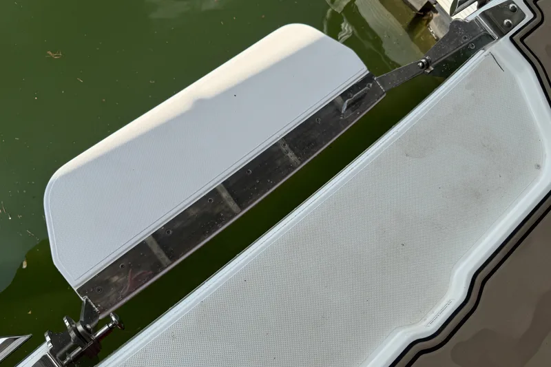 Slide: The Image of 2019 Cobalt R5 boat swim platform with stainless steel hardware on green water. - 31