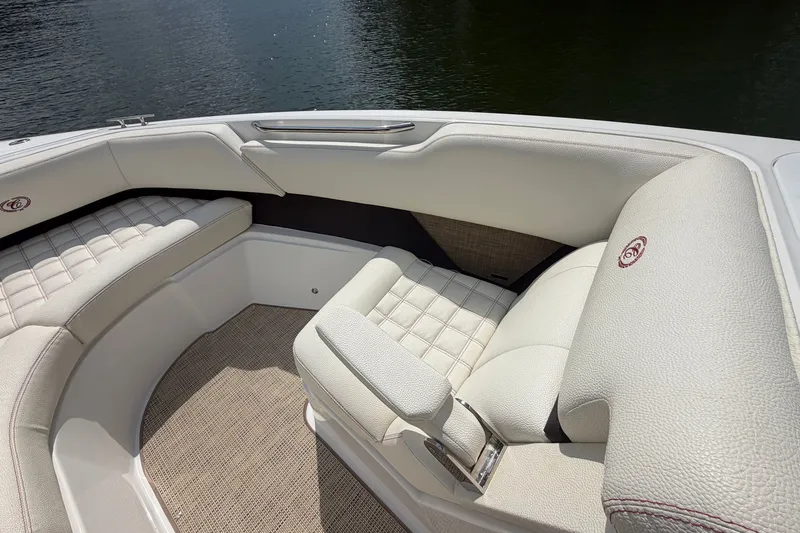 Slide: The Image of Luxurious seating on a 2019 Cobalt R5 boat, featuring elegant white upholstery. - 24