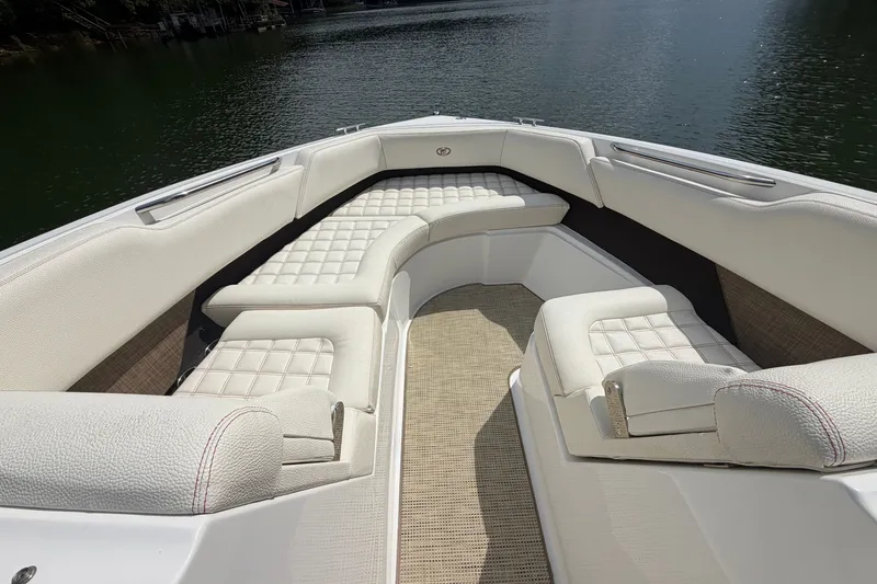 Slide: The Image of 2019 Cobalt R5 boat interior with luxurious white seating and lake view. - 23