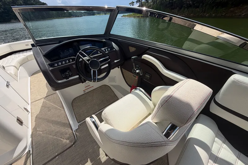 Slide: The Image of Interior of a 2019 Cobalt R5 boat with sleek dashboard and comfortable seating. - 26