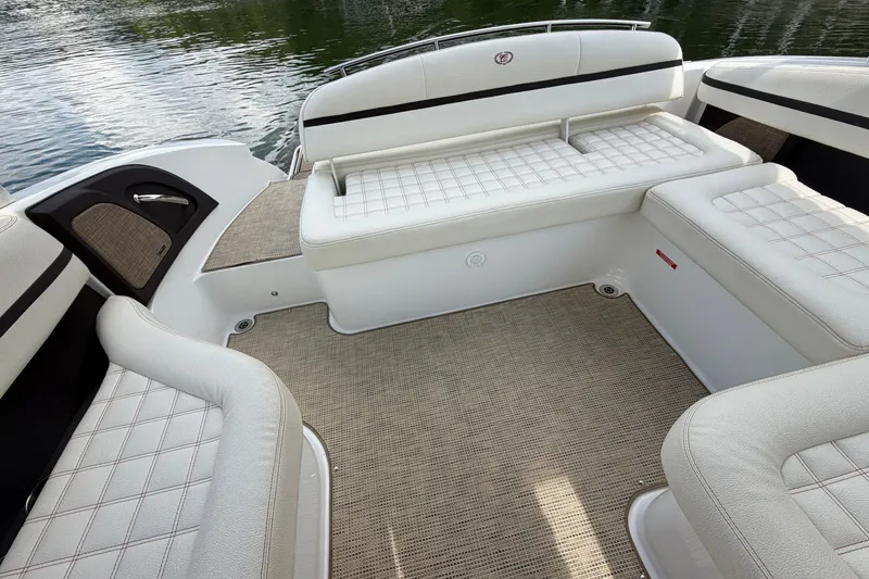 Slide: The Image of Luxurious interior of a 2019 Cobalt R5 boat with white cushioned seating. - 19