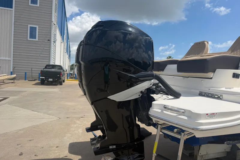 Slide: The Image of 2016 Sea Ray 290 Sundeck Outboard boat with powerful engine, docked outdoors. - 19