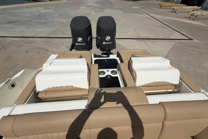 Slide: The Image of 2016 Sea Ray 290 Sundeck Outboard with dual Mercury engines at dockside. - 16