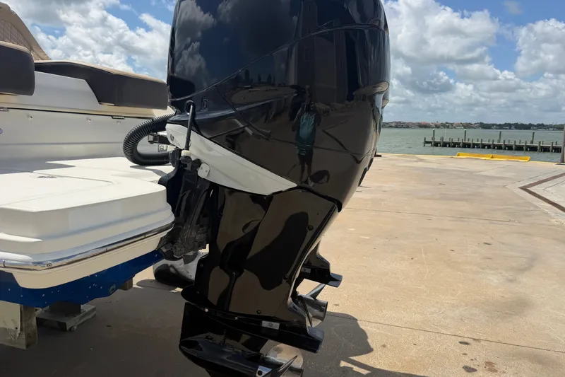 Slide: The Image of 2016 Sea Ray 290 Sundeck Outboard motor at a dockside location. - 21