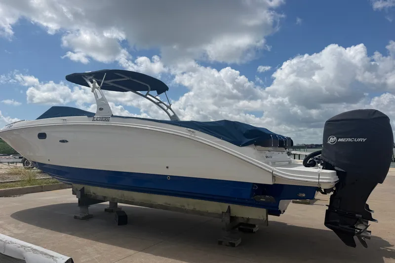 The Image of 2016 Sea Ray 290 Sundeck Outboard boat with Mercury engine on a sunny day. - 0