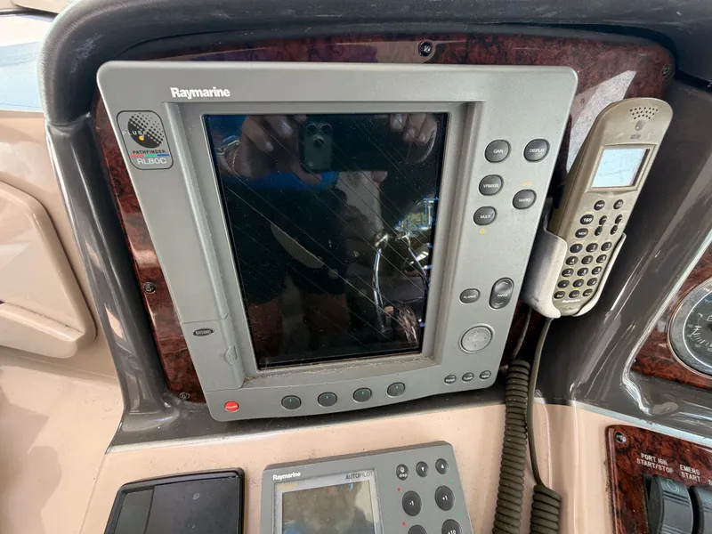 Slide: The Image of The image shows a Raymarine navigation system on a Sea Ray 420 Sundancer boat. - 21