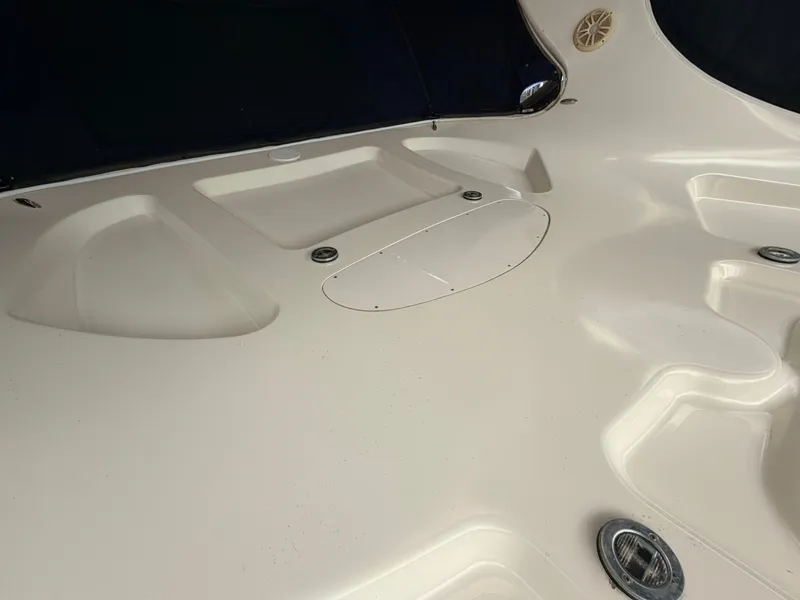 Slide: The Image of The image shows the spacious cockpit of a 2004 Sea Ray 420 Sundancer with sleek lines. - 18