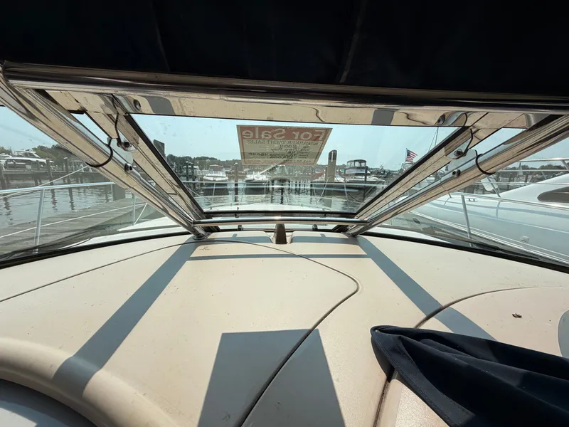 Slide: The Image of View from the cockpit of a Sea Ray 420 Sundancer overlooking a marina with several boats. - 26