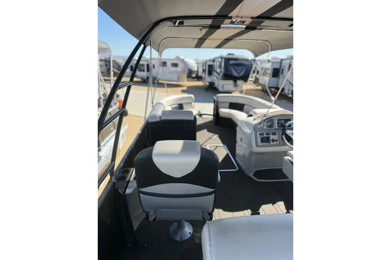Slide: The Image of Interior view of a 2017 South Bay 500 Sport boat with seating and control panel. - 15