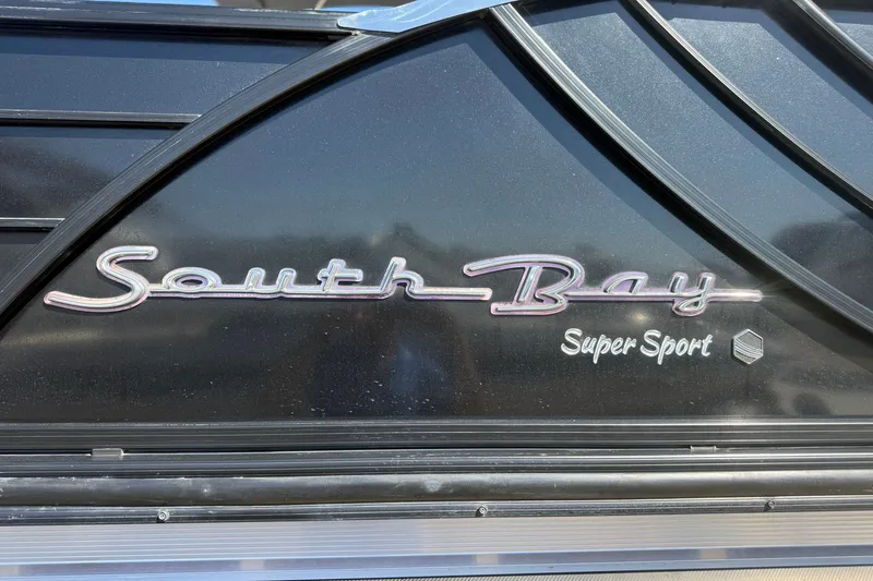 Slide: The Image of 2017 South Bay 500 Sport boat logo on black surface. - 6