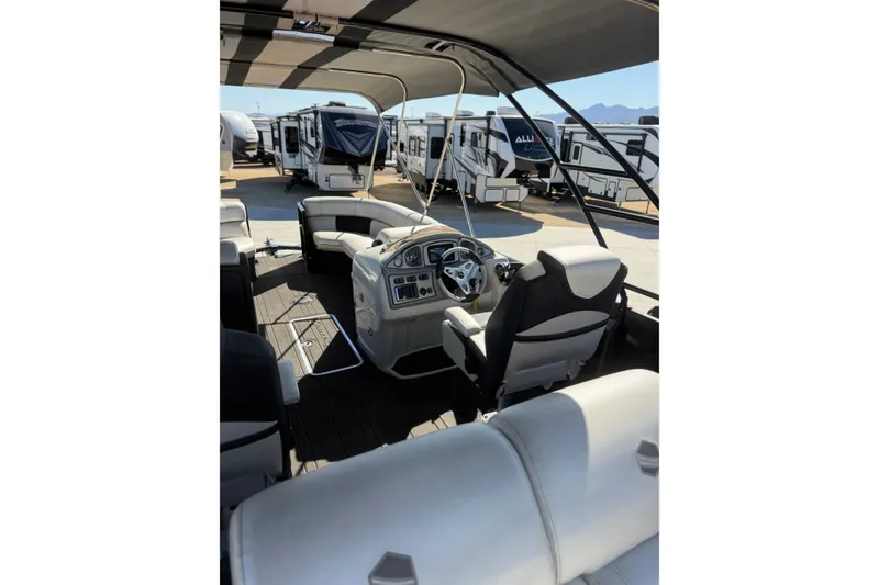 Slide: The Image of Interior of a 2017 South Bay 500 Sport boat with modern seating and dashboard. - 11