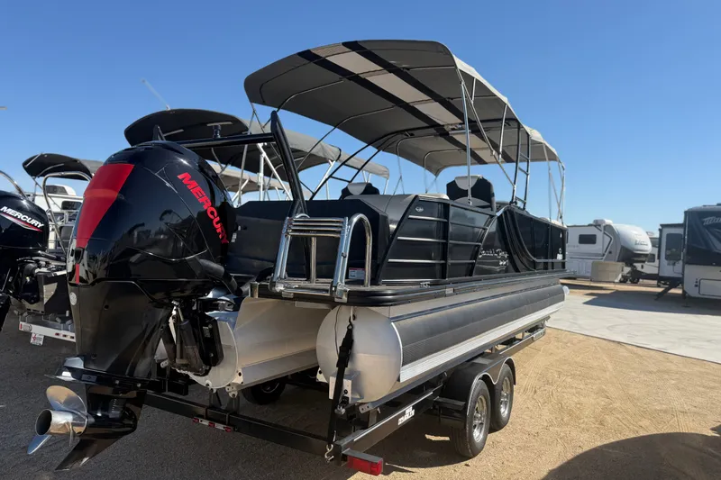 Slide: The Image of 2017 South Bay 500 Sport pontoon boat with Mercury outboard motor, parked on a trailer. - 2
