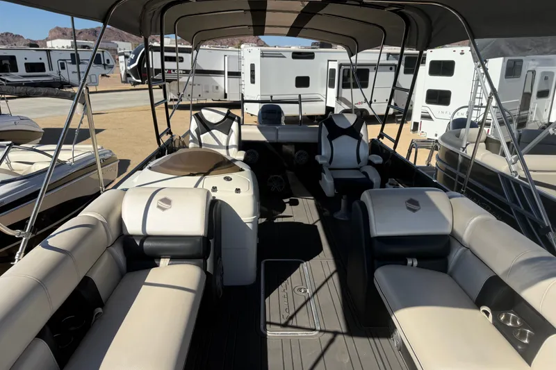 Slide: The Image of 2017 South Bay 500 Sport pontoon boat interior with plush seating and canopy. - 7