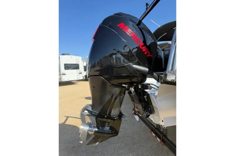 Slide: The Image of Mercury outboard motor on 2017 South Bay 500 Sport boat, parked outdoors. - 5
