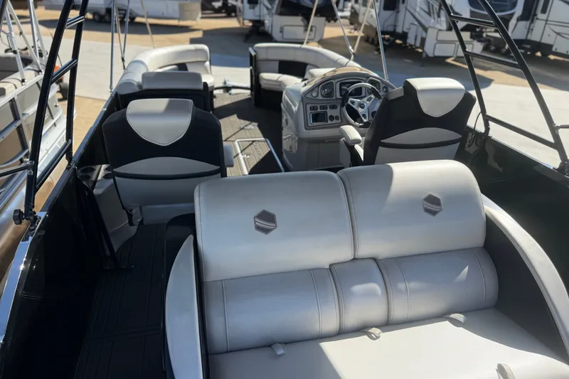 Slide: The Image of Interior view of a 2017 South Bay 500 Sport boat with seating and steering console. - 16