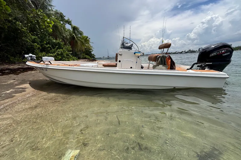 The Image of 2002 Scout 240 Bay Scout boat on sandy shore with Yamaha engine. - 14