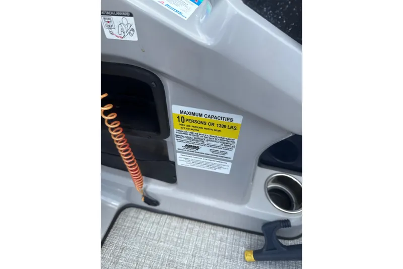 Slide: The Image of 2024 Harris Cruiser 230 capacity label, maximum 10 persons or 1339 lbs. - 9