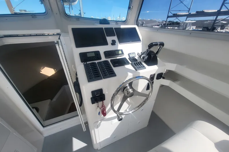 Slide: The Image of 2020 Steiger Craft 28 Miami boat helm with modern controls and navigation equipment. - 21