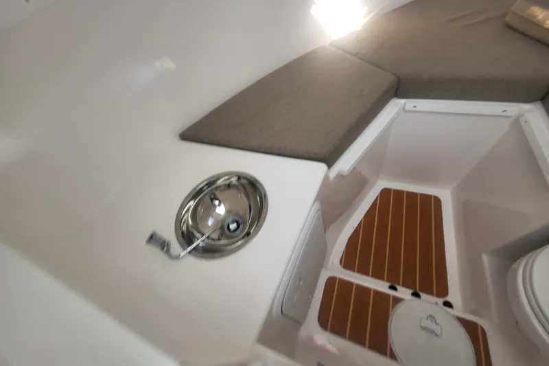 Slide: The Image of 2020 Steiger Craft 28 Miami cabin interior with sink and cushioned seating. - 26