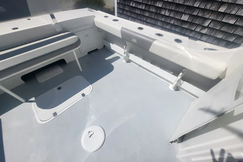 Slide: The Image of 2020 Steiger Craft 28 Miami boat interior with seating and storage compartments. - 13