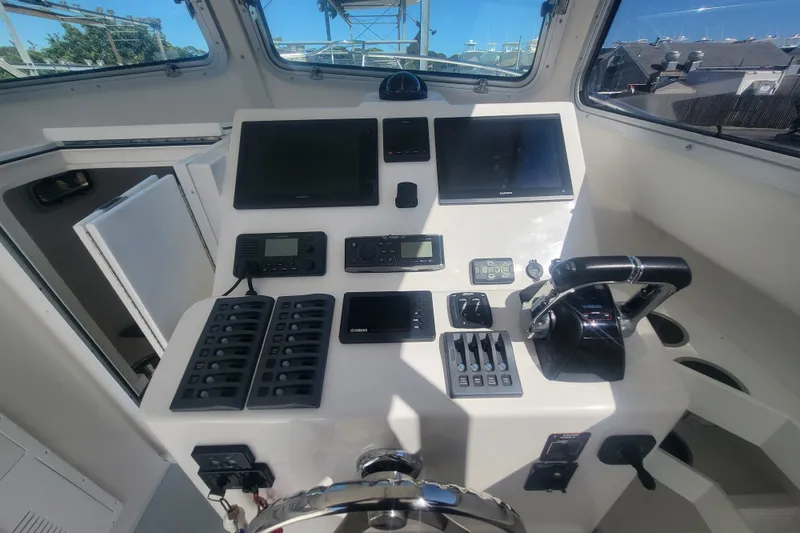 Slide: The Image of Steiger Craft 28 Miami 2020 boat dashboard with navigation controls and displays. - 20