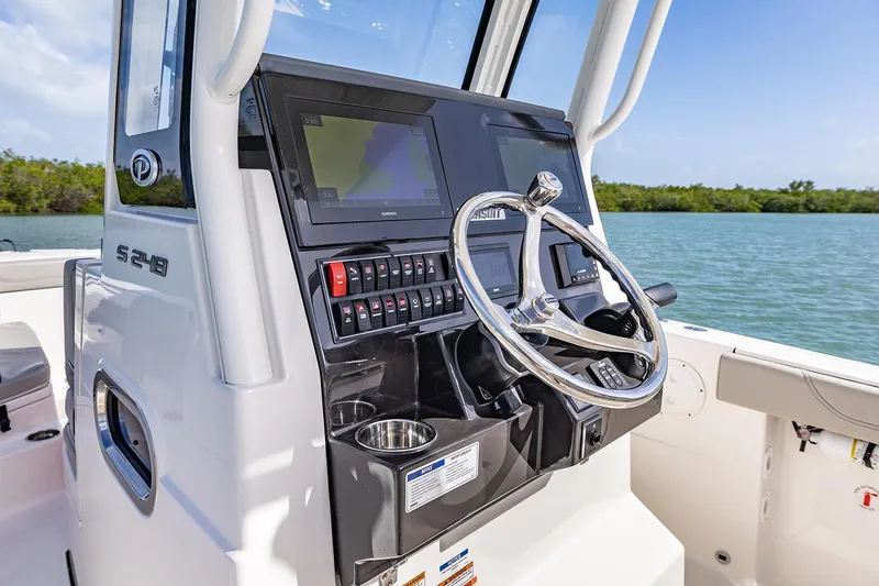 Slide: The Image of Manufacturer Provided Image: 2025 Pursuit S 248 Sport boat console with steering wheel and navigation system. - 11