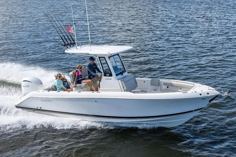 Slide: The Image of Manufacturer Provided Image: 2025 Pursuit S 248 Sport boat cruising on water with passengers enjoying the ride. - 3