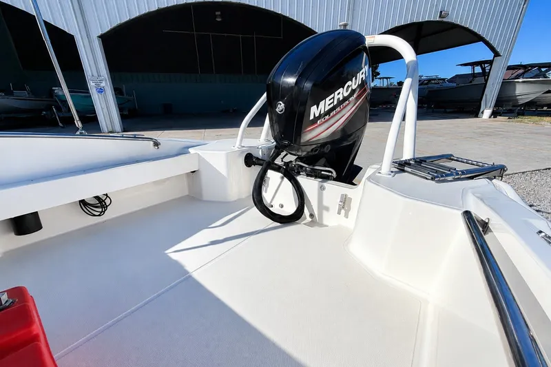 Slide: The Image of 2019 Boston Whaler 160 Super Sport with Mercury outboard engine in a boatyard. - 10