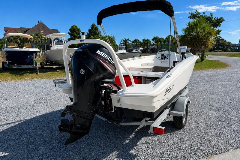 Slide: The Image of 2019 Boston Whaler 160 Super Sport boat with Mercury engine on trailer. - 7
