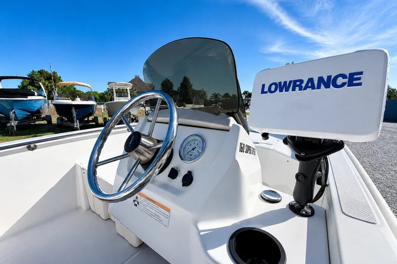 Slide: The Image of 2019 Boston Whaler 160 Super Sport boat dashboard with Lowrance Elite system. - 14