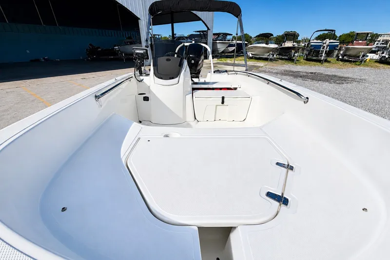 Slide: The Image of 2019 Boston Whaler 160 Super Sport boat interior with seating and steering console. - 19