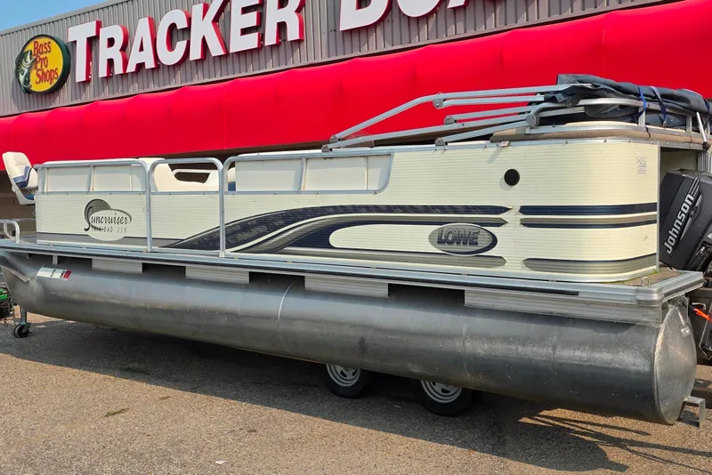 Slide: The Image of 2000 Lowe Suncruiser Trinidad 220 pontoon boat at Bass Pro Shops Tracker display. - 1