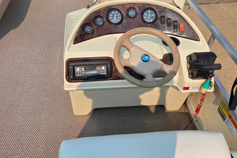 Slide: The Image of Steering console of a 2000 Lowe Suncruiser Trinidad 220 pontoon boat. - 8