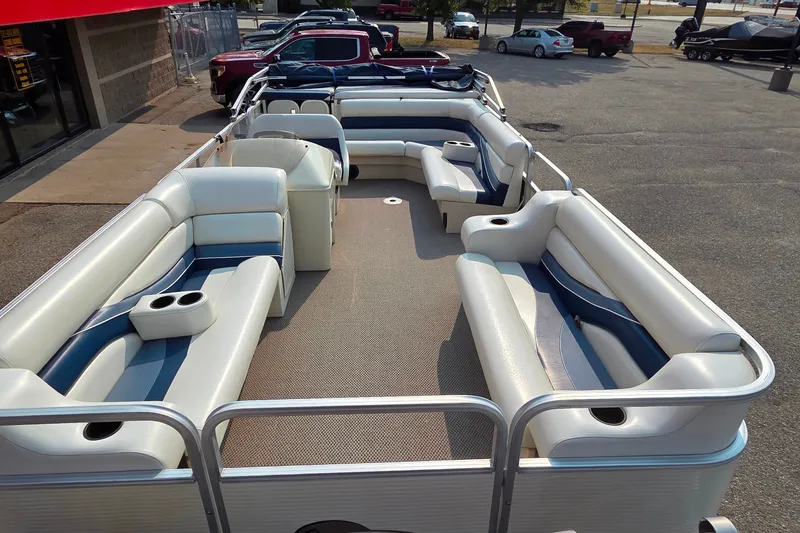 Slide: The Image of 2000 Lowe Suncruiser Trinidad 220 pontoon boat with spacious seating and cup holders. - 9