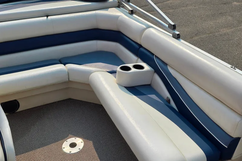 Slide: The Image of Interior seating of a 2000 Lowe Suncruiser Trinidad 220 pontoon boat with cup holders. - 6