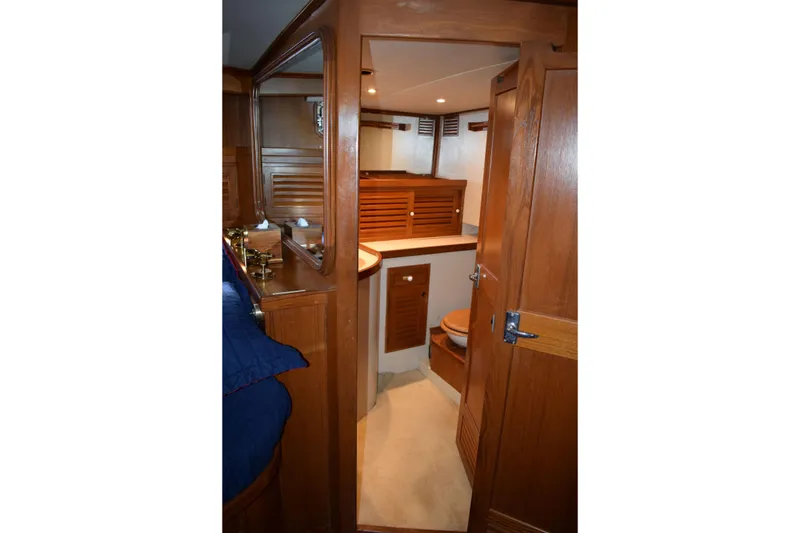 Slide: The Image of Interior of 1980 Cheoy Lee 52 Motorsailer with wooden cabinetry and cozy design. - 68