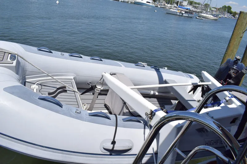 Slide: The Image of Inflatable boat docked near a Cheoy Lee 52 Motorsailer, 1980 model, on a sunny day. - 31