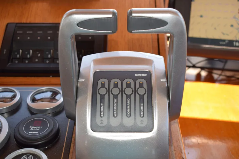 Slide: The Image of Control panel of a 1980 Cheoy Lee 52 Motorsailer with engine and command switches. - 50